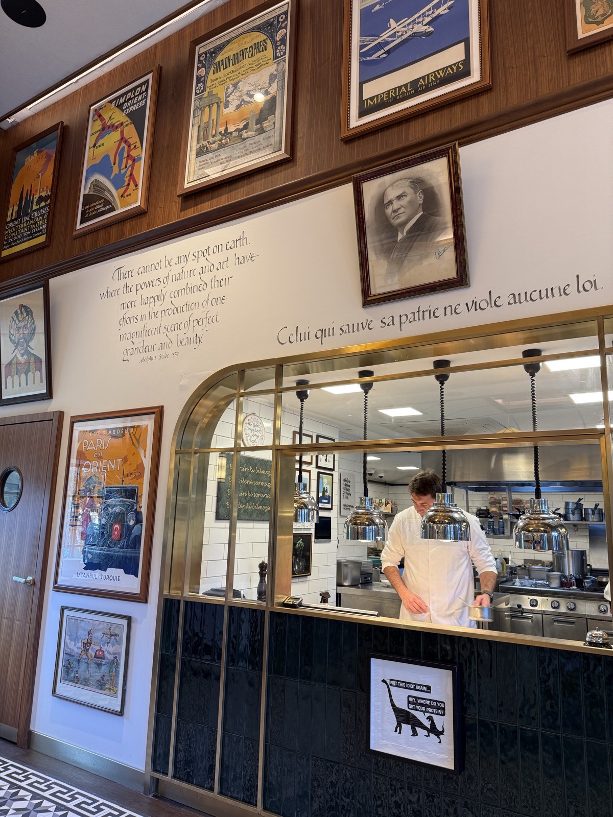 The open kitchen, and the collection on the walls